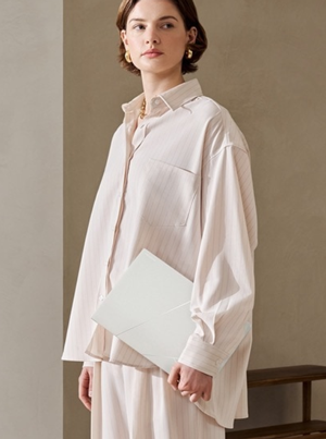 lady casually holding laptop in hand