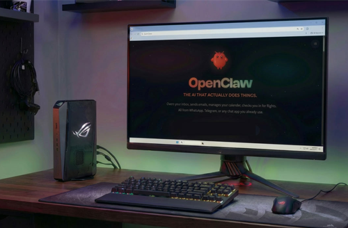 Monitor with OpenClaw on-screen, on a desk beside ASUS ROG GR70.