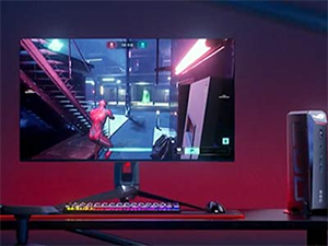 Mini PC next to a monitor and keyboard setup
