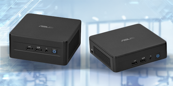 Monitor, keyboard and mouse on desk beside the ASUS NUC