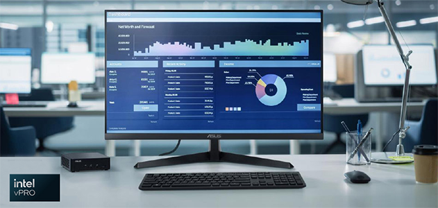 Monitor, keyboard and mouse on desk beside the ASUS NUC