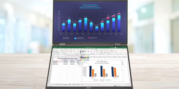 Front view of PD3 dual screen on a desk with graph on the top screen and a spreadsheet on the bottom.