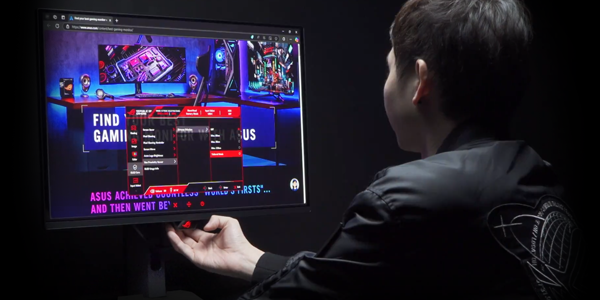 man switching settings on a monitor screen