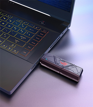 ROG USB-BE92 plugged into the side of a laptop.