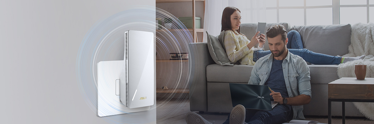 RP-AX58 range extender, plugged into wall with couple relaxing in living room.