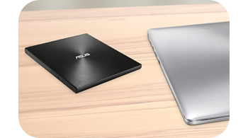 Photo of ZenDrive on a desk next to an ASUS Laptop