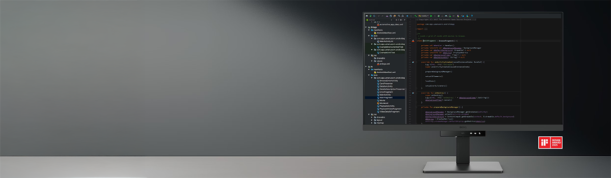 Image of RD320U programming monitor on a desktop with coding software on-screen, highlighting its clarity