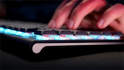 Hand typing on the XTRFY keyboard, showcasing mx low profile 2.0 switches