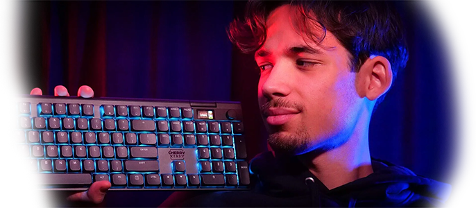 Person holding keyboard in one hand to showcase premium design