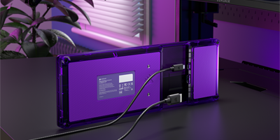 Xeneon Edge LCD display underneath monitor displaying movie.