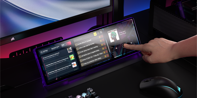 Xeneon Edge LCD display underneath monitor displaying movie.