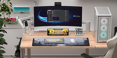 Xeneon Edge LCD display underneath monitor displaying PC desktop.