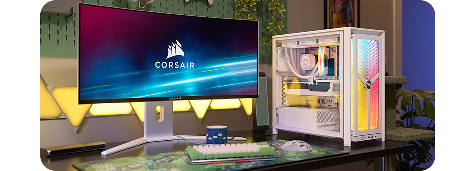 Image of the 4000X case on a desktop setup next to a monitor, surrounding it are colourful room decorations