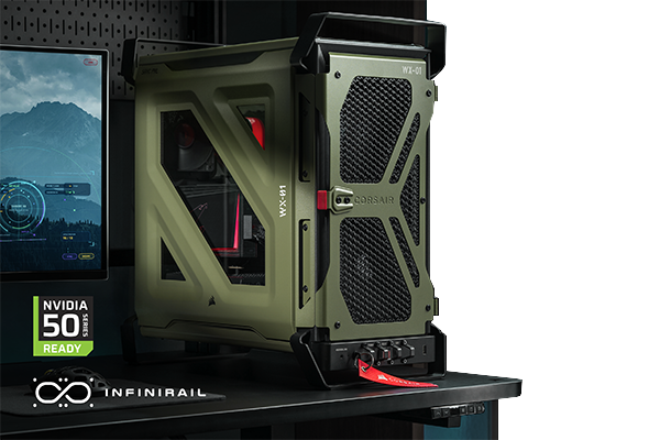 Black CORSAIR WARTHOG case on desk with monitor edge appearing from the left.