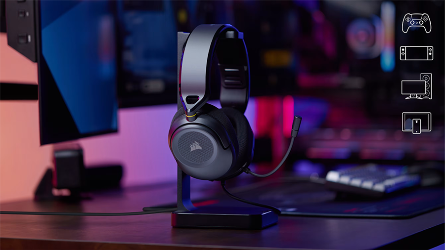 Black headphones on stand in futuristic gaming setup