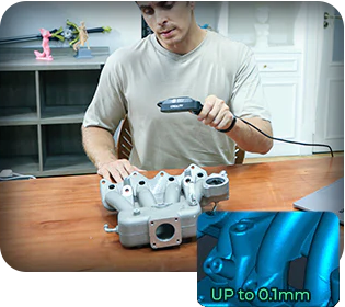 Man scanning auto part on workshop table