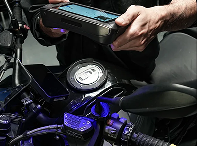 Person using Sermoon P1 3D scanner on the top of a motorcycle.
