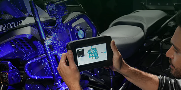 Man scanning a BWM motorcycle with Sermoon P1 3D scanner.