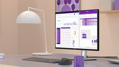 Dell Pro Plus monitor in a modern home office, displaying a graph on-screen to highlight improved ComfortView Plus