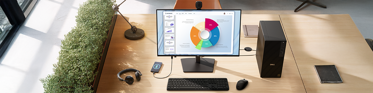 Dell Pro P Monitor on office desk next to Dell PC and peripherals.