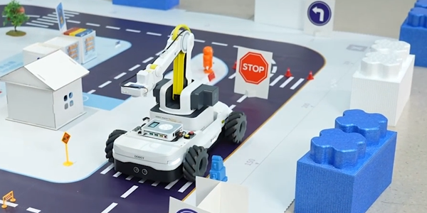Magician Go on a toy track, demonstratring autononomous AI driving.