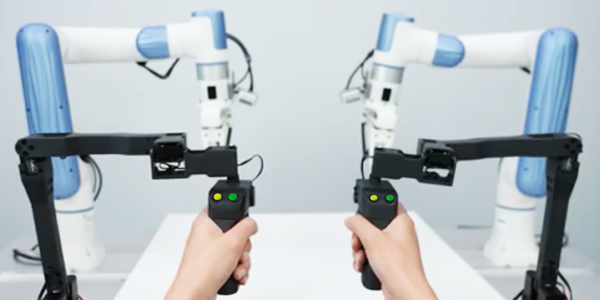 Point-of-view angle of X-Trainer's control sticks being operated by two hands