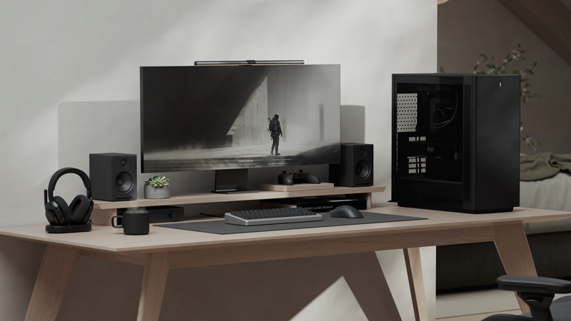 Side facing view of case on desk with minimal wooden beige coloured setup