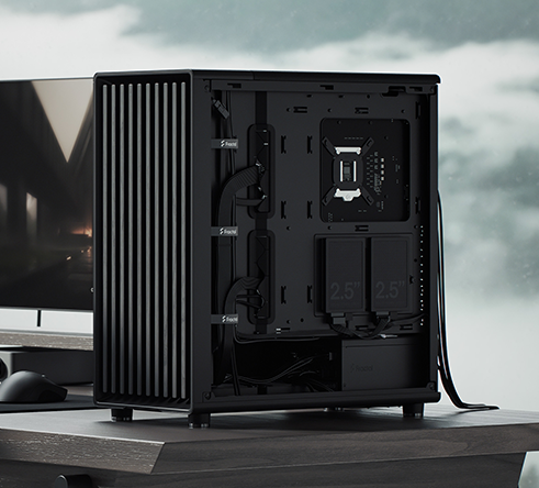 Alternate side of case on desk with cables and SSD mounts visible