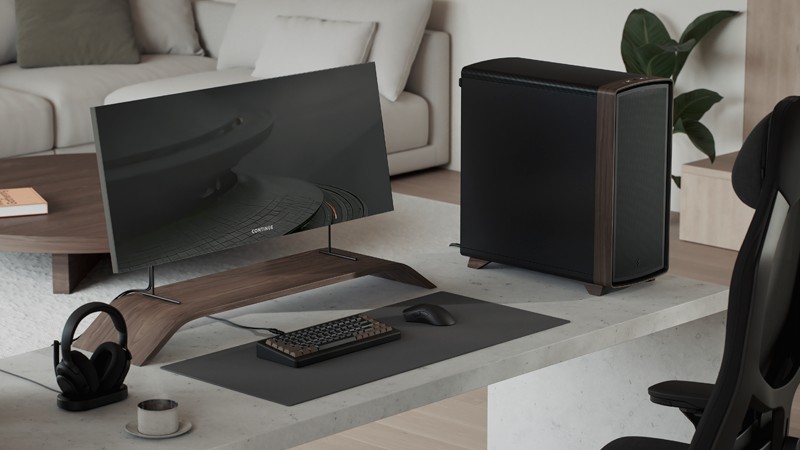 Side facing view of case on desk with minimal wooden beige coloured setup