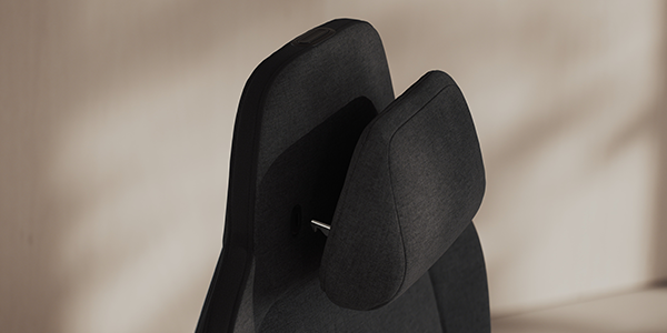 Close up of memory foam headrest at the top of the seat.