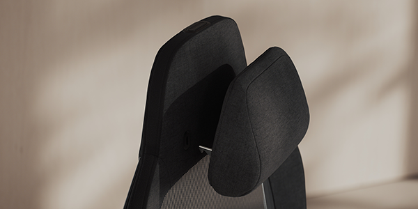 Close up of memory foam headrest at the top of the seat.