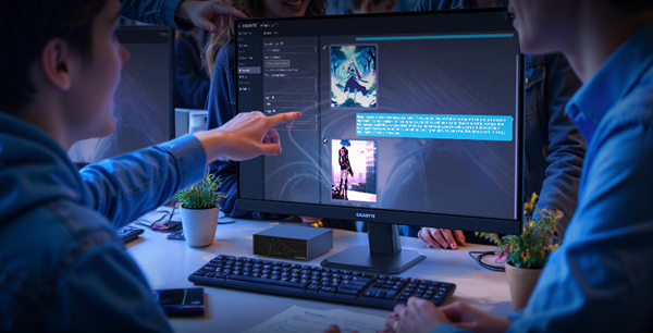 Working professionals discuss workload on-screen with Gigabyte AI TOP ATOM sat on their desk