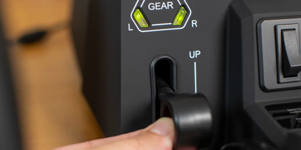 Finger pulling gear lever with green LED indicator lights above. 