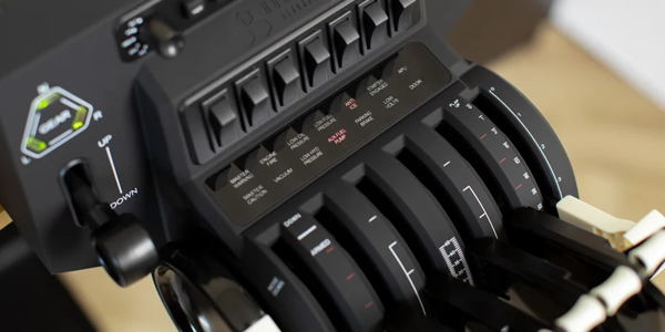 Throttle with levers pulled down, revealing switches and markings on its panel.