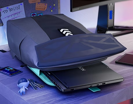 grey leather bag with laptop coming out