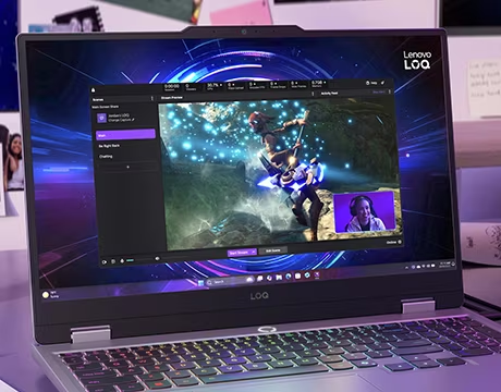 angled shot of laptop with streaming software open and lady smiling in a window in the corner of the screen