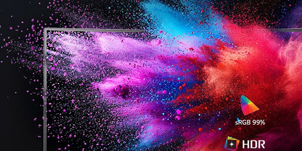 UltraGear monitor with colourful particle explosion.