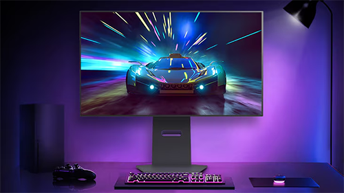 Image of the monitor on a desk with purple lighting and a sports car on screen