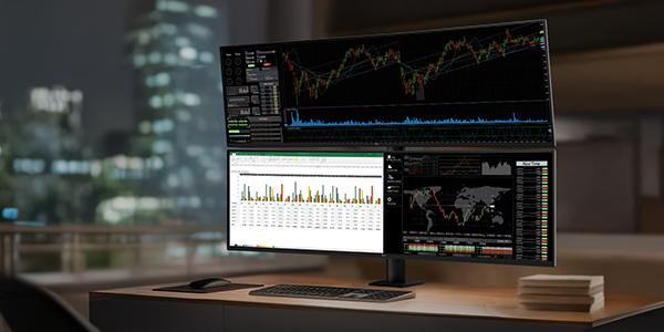 UltraWide monitor with statistical software application on-screen - set in an office environment.