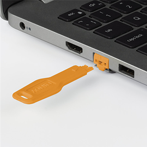 Port blocker plugged into RJ45 port with key next to the blocker.