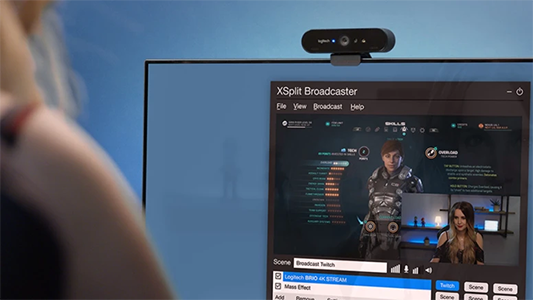 Logitech Brio Stream webcam on monitor with Xbox Broadcaster on-screen.