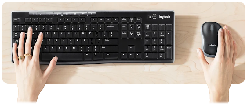 Office worker typing and using mouse
