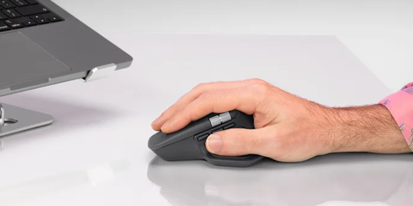 Hand using the MX Master 4 mouse.