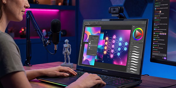 Female using laptop to design graphics on photoshop.