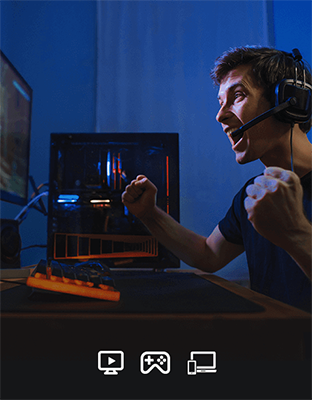 Gamer sat infront of PC celebrating a win as a result of his WiFi 7 speeds.