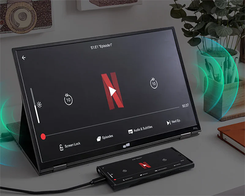 Image of a smartphone plugged into the monitor streaming Netflix