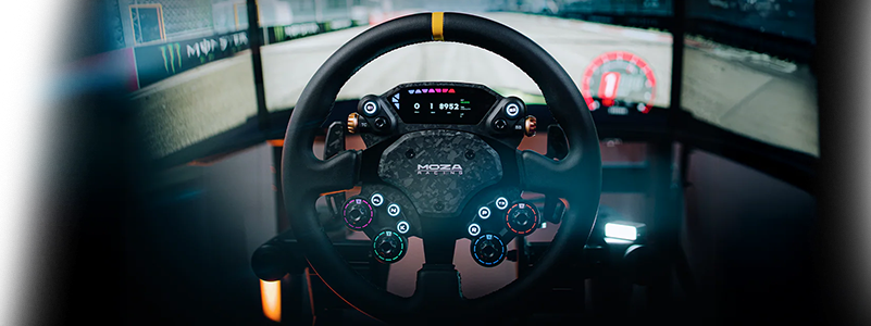 Key visual of racing wheel infront of triple monitor setup with racing game on-screen.