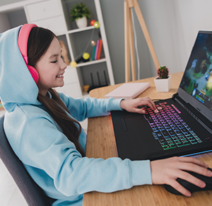 Young woman gaming on her laptop.