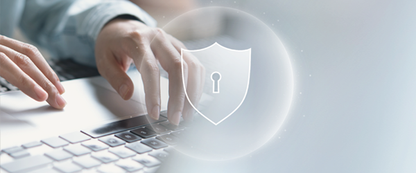Network security shield graphic overlay with close up of laptop 
