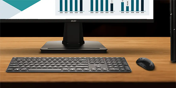 FORGE keyboard and mouse combo on a desk with monitor 